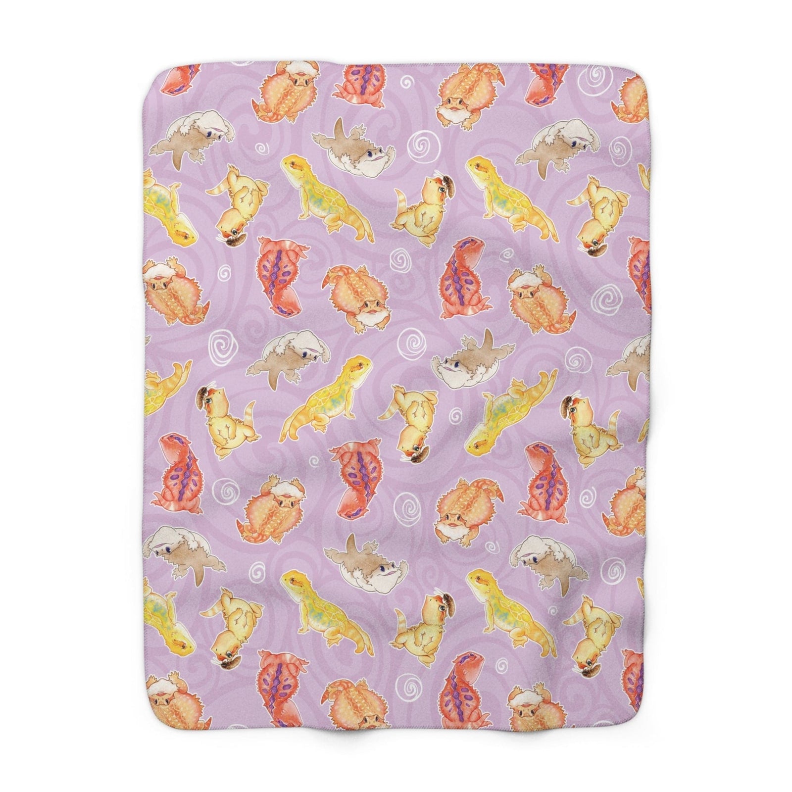 Purple blanket with colorful bearded dragon pattern on a white background.