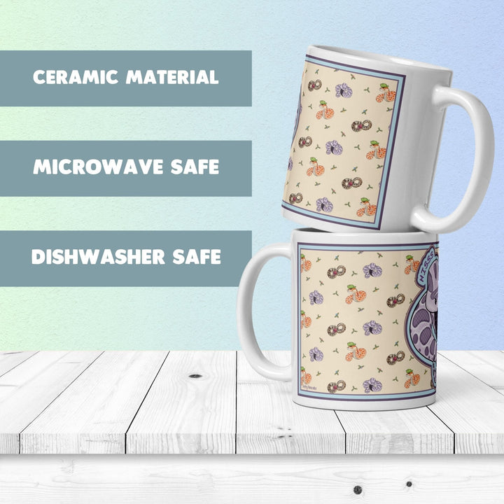 Two mugs stacked on top vertically with text next to it saying "Ceramic Material", "Microwave Safe", and "Dishwasher Safe."