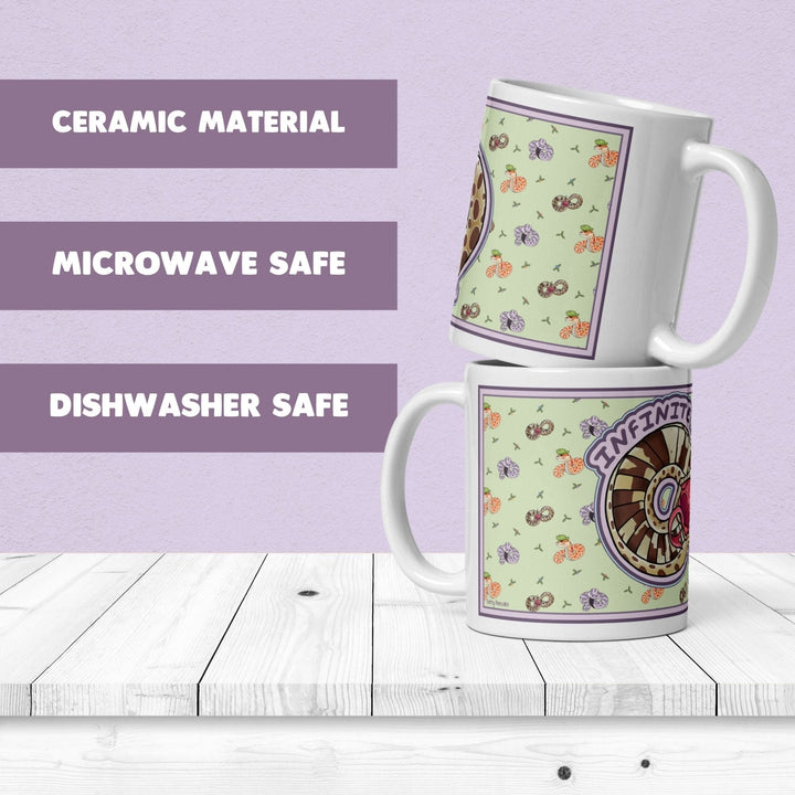 Two white ceramic mugs stacked vertically, featuring a light green background with a repeating pattern of small colorful snakes. The text CERAMIC MATERIAL, MICROWAVE SAFE, and DISHWASHER SAFE appears on the left.