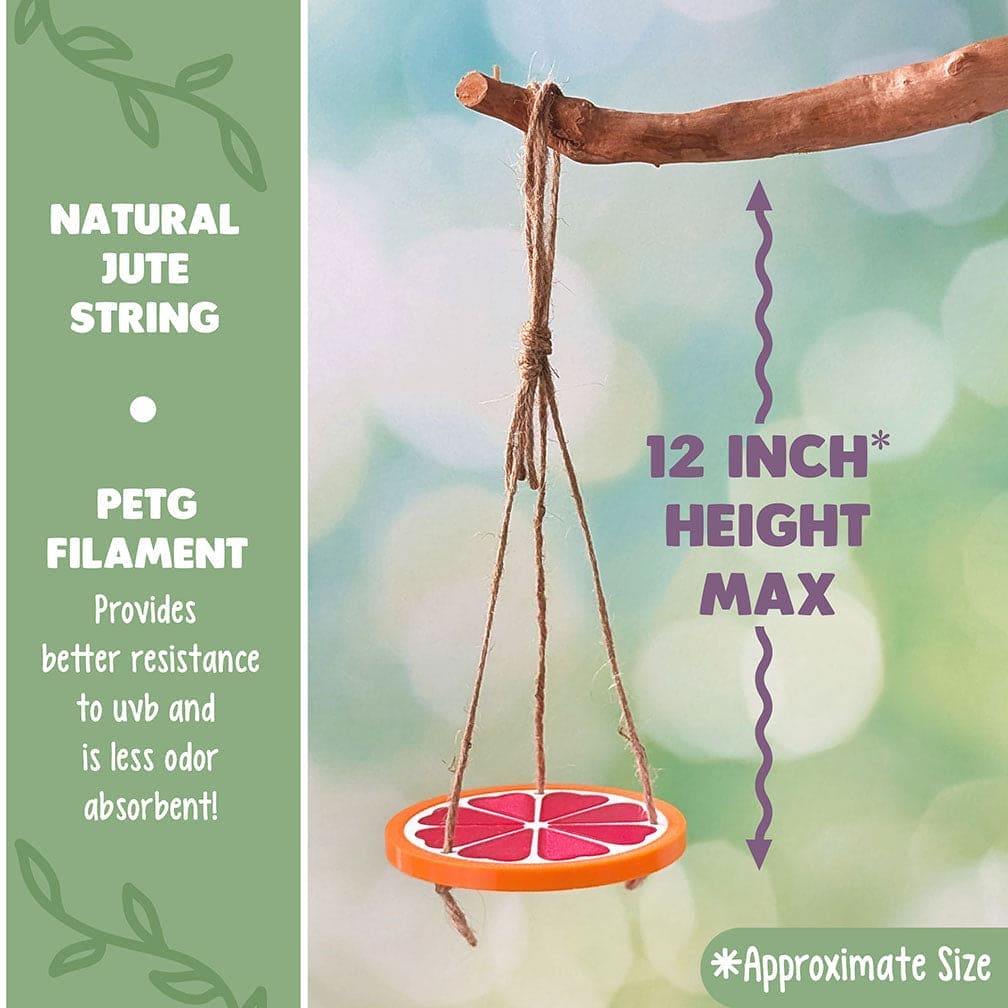 Decorative reptile or frog swing of a plastic grape fruit slice hanging from a branch with a blurred natural background. Text reads: Natural Jute String and PETG Filament: Provides better resistance to UVB and less odor absorbent.
