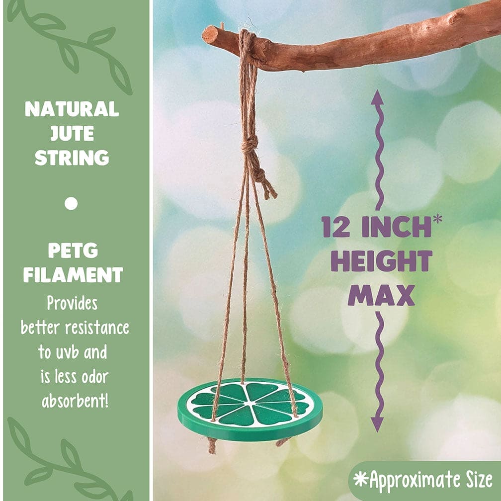 Decorative reptile or frog swing of a plastic lime slice hanging from a branch with a blurred natural background. Text reads: Natural Jute String and PETG Filament: Provides better resistance to UVB and less odor absorbent.