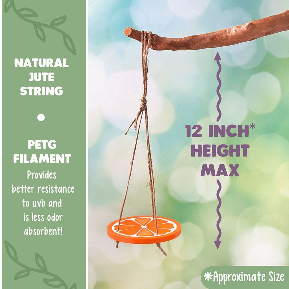 Decorative reptile or frog swing of a plastic orange slice hanging from a branch with a blurred natural background. Text reads: Natural Jute String and PETG Filament: Provides better resistance to UVB and less odor absorbent. 