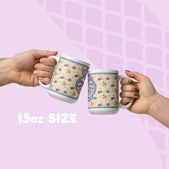 Two hands holding a mug with a pattern against a soft lavender background and a snake scale graphic, labeled '15oz SIZE'.