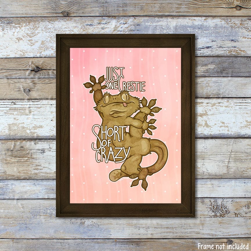 A mock up of a vertical oriented picture frame with a silly cartoon crested gecko with it&
