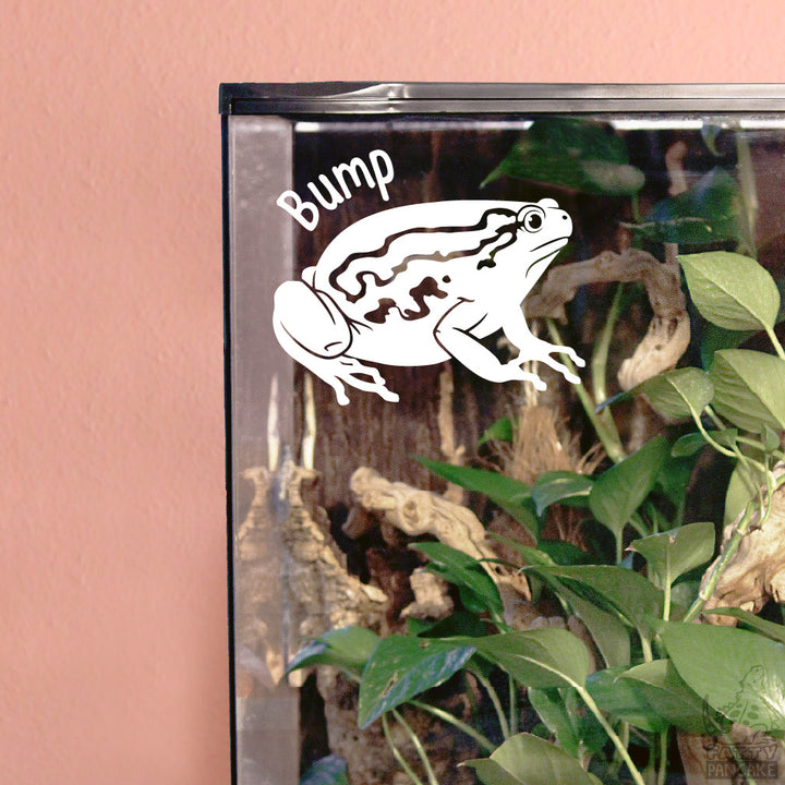 A white vinyl decal of a Chubby Bullfrog with the word &