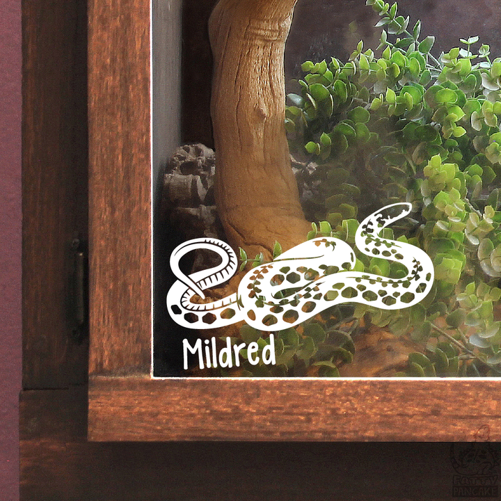 A white vinyl decal of a coiled Kirtland&