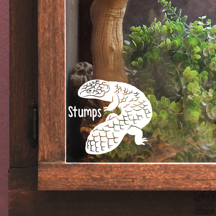 A white vinyl decal of a shingleback skink with the name &