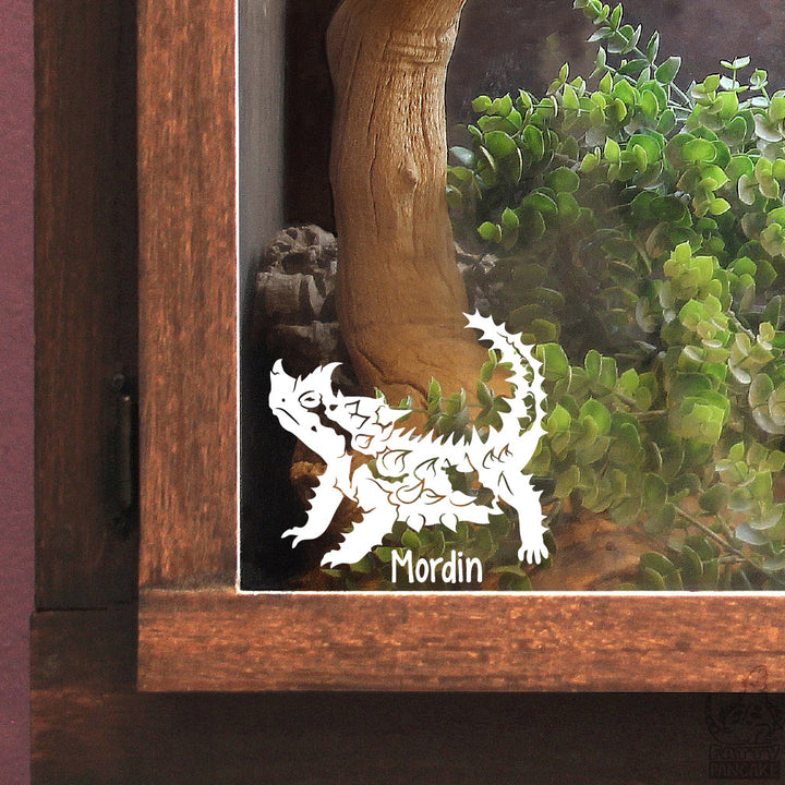 A white vinyl decal of a Thorny Devil lizard with the name &
