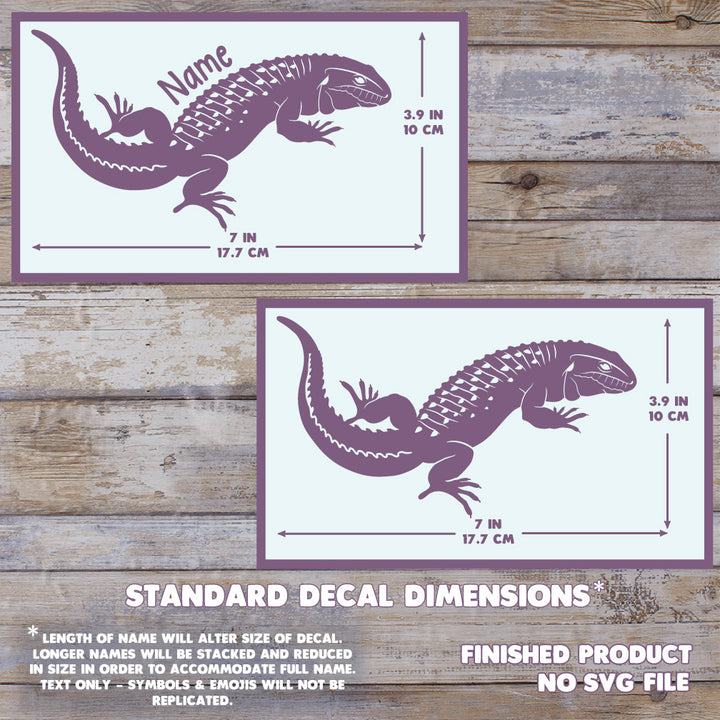 Two images showing the dimensions of the Caiman Lizard Decal. With a name, it measures 3.9" Tall, by 7" Wide. Without a name, 3.9" Tall by 7" wide. The background has a wooden texture and this is a final product, no digital file is sold.