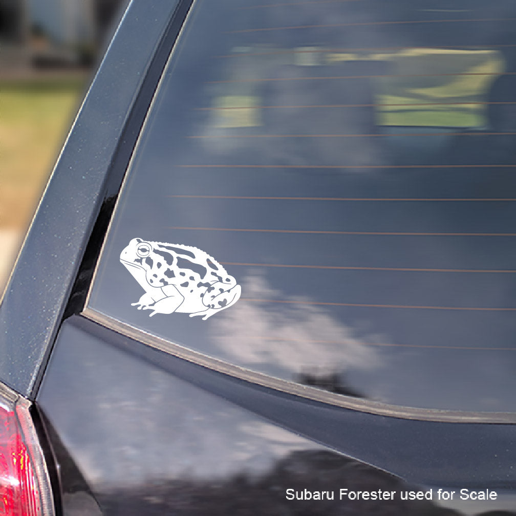 White Great Plains Toad decal on a dark-colored car window with 'Subaru Forester used for scale' text.