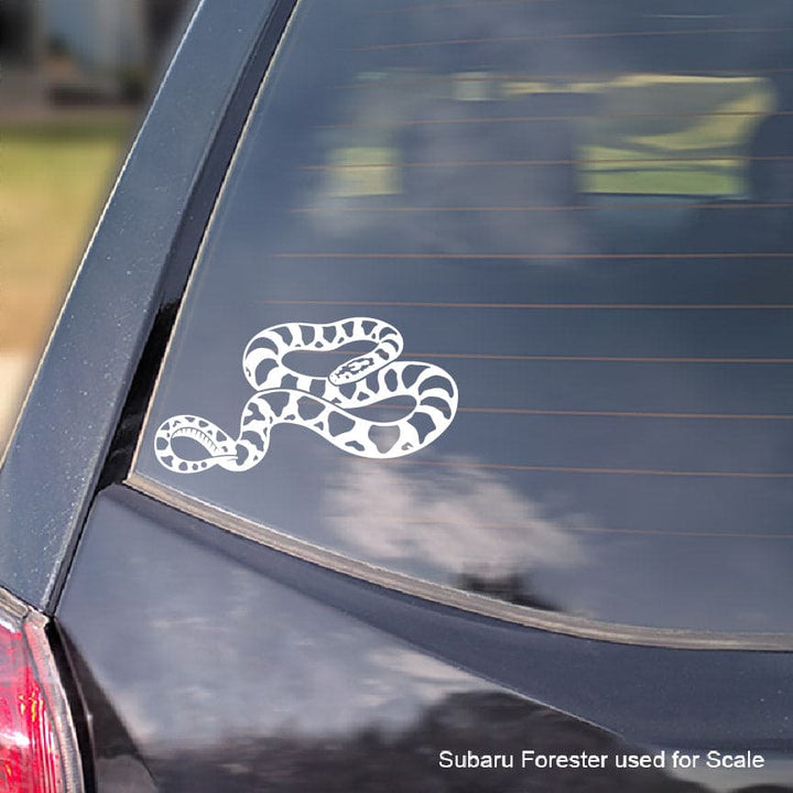 White snake decal on a car window with 'Subaru Forester used for scale' text.