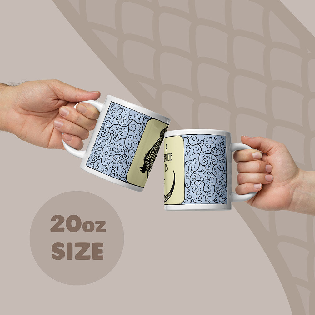 Two white ceramic mugs with an 20oz capacity, each featuring a blue and black swirling filigree pattern on the sides. The mugs display a graphic of a bearded dragon with text in the body.