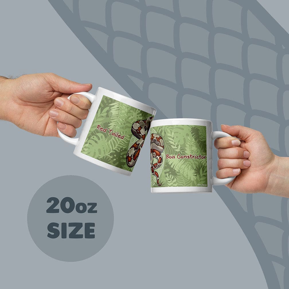 Two white ceramic mugs with an 20oz size capacity, each featuring a green fern leaf pattern and a red-tailed boa constrictor illustration. The text Red Tailed is printed on one mug and Boa Constrictor is printed on the other mug.