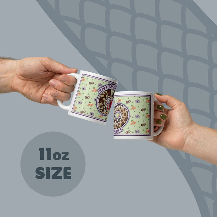Two hands holding the dramatic hognose 11oz mugs against a gray back ground.