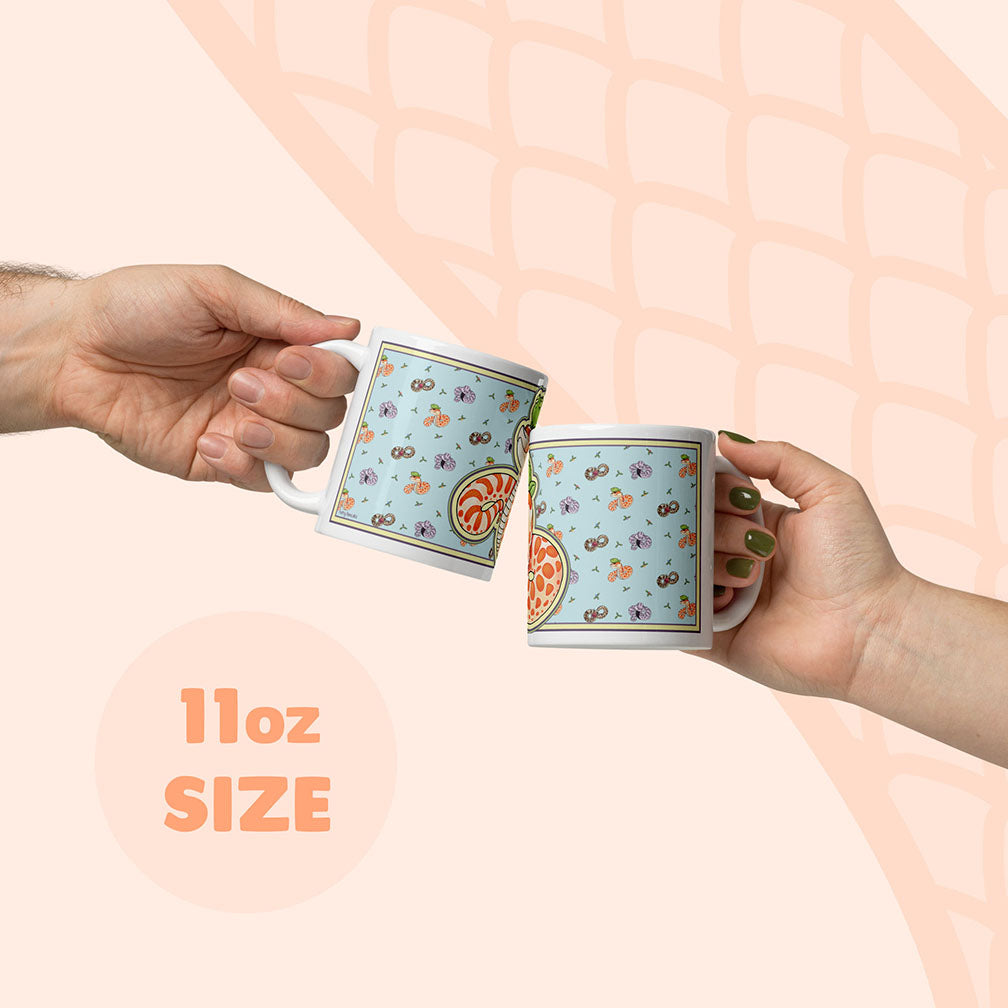 Two hands holding a 11oz mug to display size compared to a human hand.
