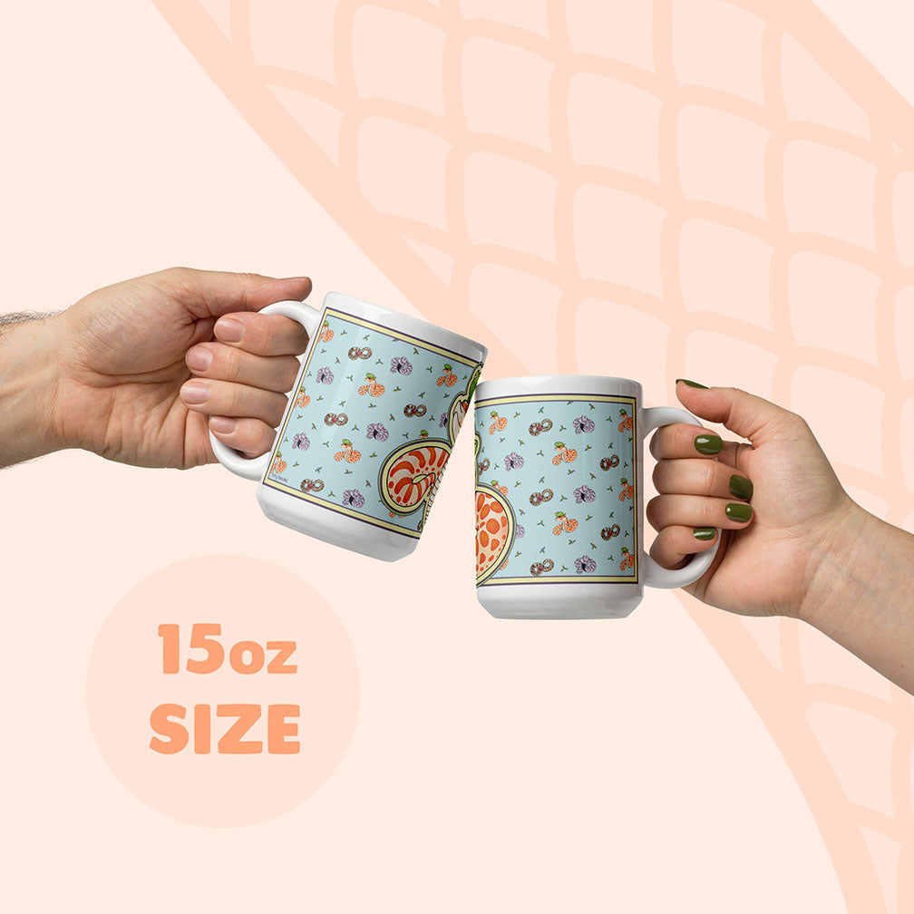 Two hands holding a 15oz mug to display size compared to a human hand.
