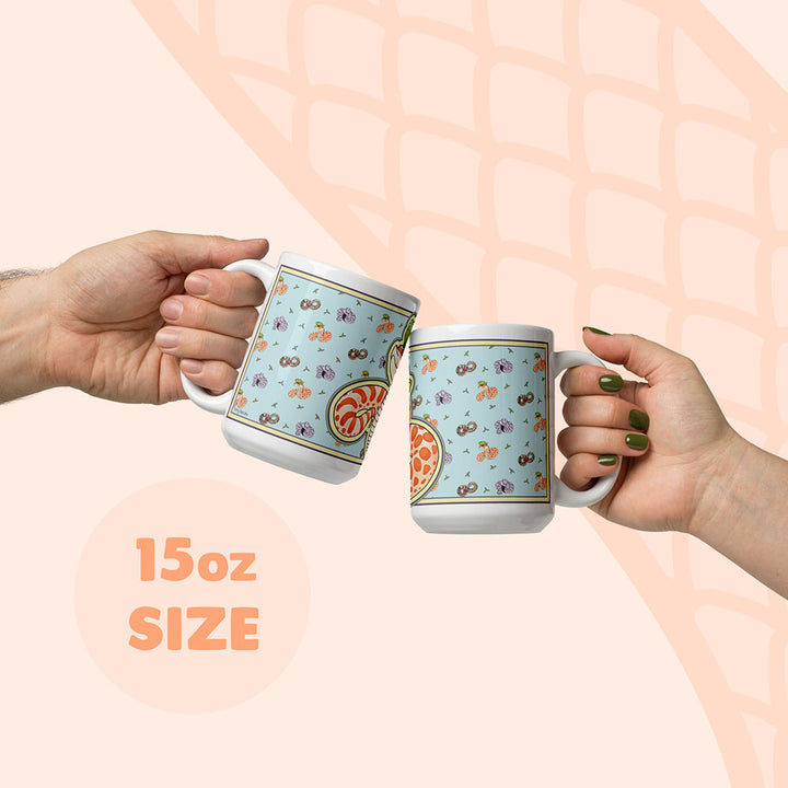 Two hands holding a 15oz mug to display size compared to a human hand.