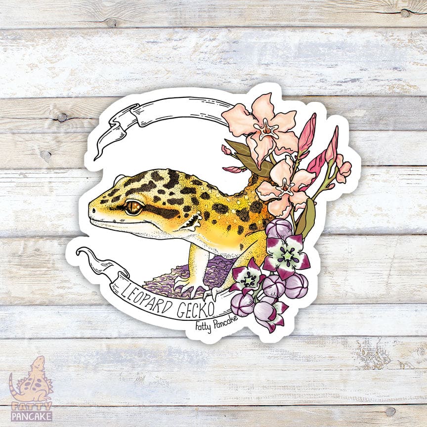 A vinyl sticker featuring a yellow and black leopard gecko with pink and purple flowers framing the right side of the design. The sticker has a white banner with the text "Leopard Gecko" sold by "Fatty Pancake".