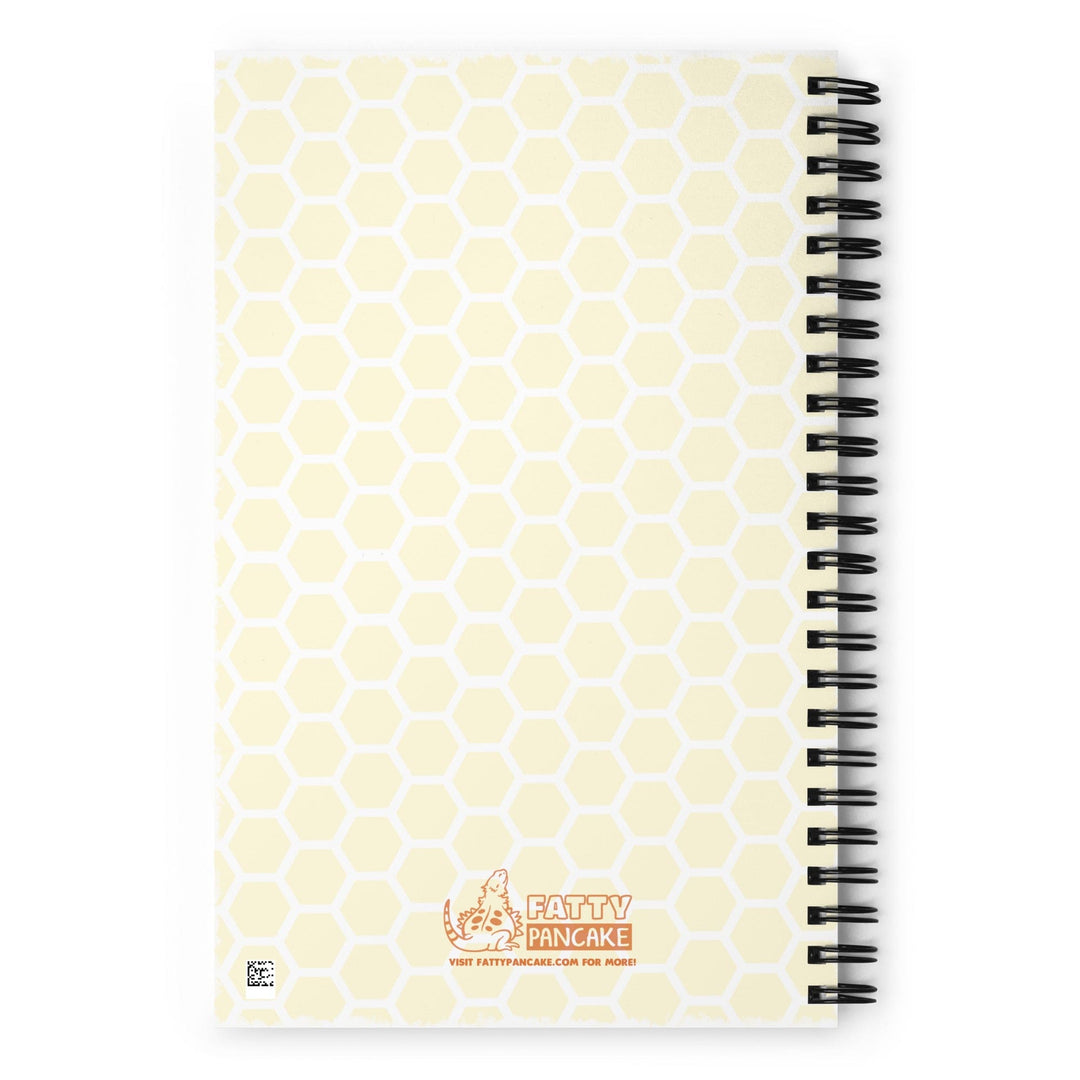 A spiral-bound notebook with a pale yellow honeycomb pattern cover and the Fatty Pancake logo near the center bottom. The notebook is displayed on a bright white background.
