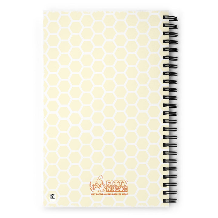 A spiral-bound notebook with a pale yellow honeycomb pattern cover and the Fatty Pancake logo near the center bottom. The notebook is displayed on a bright white background.