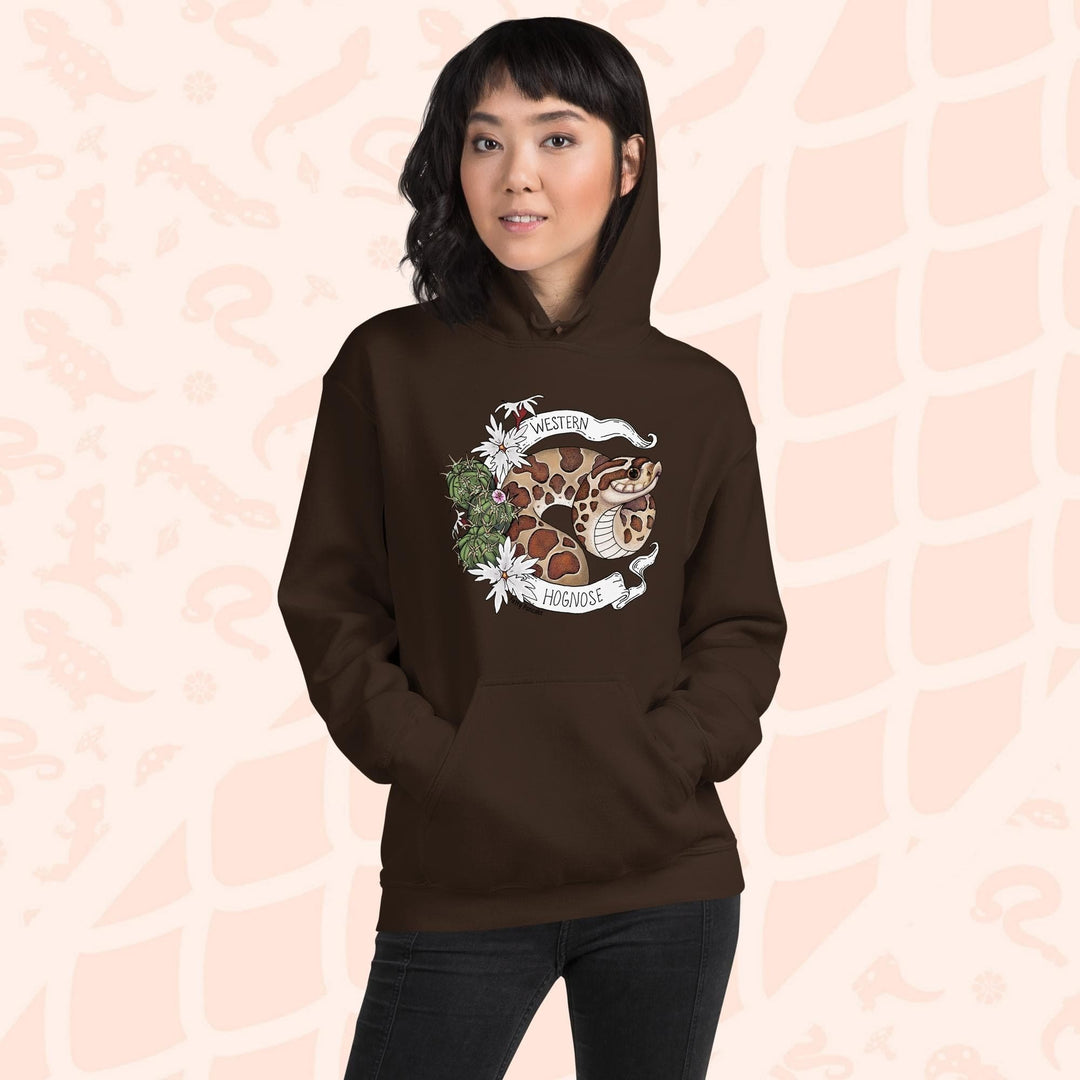 A woman wearing an chocolate brown colored hoodie with a line art with color hognose snake surrounded by a white banner with text that reads "Western Hognose". Cactus and white flowers are on the left side of the design.