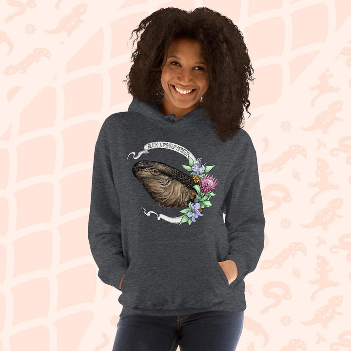 A dark grey hooded sweatshirt with a graphic of a black-throated monitor lizard with flowers and the text "Black-throated Monitor" on a white banner.