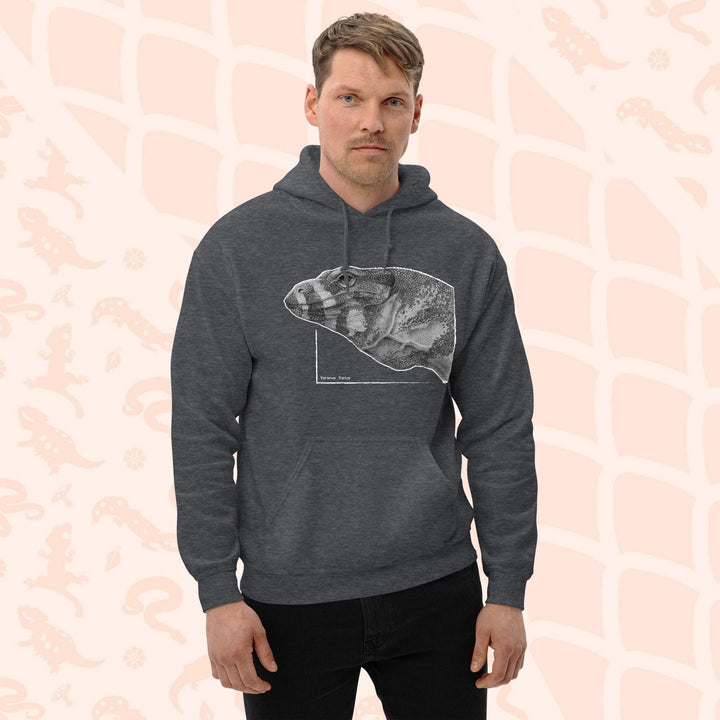 A man wearing a grey pullover hoodie with a graphic print of a pencil drawing of a lace monitor lizard. It's a profile view and highly detailed showing a close up of the scales. The hoodie has a front pocket.
