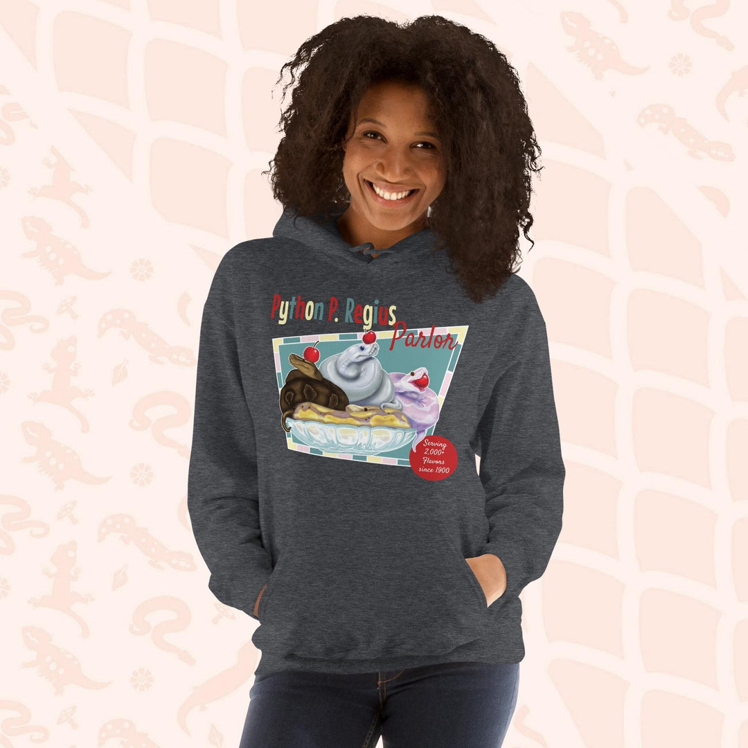 A dark grey hoodie with a retro-style graphic of a sundae with three ball pythons on top. The graphic says "Python P. Regius Parlor" and "Serving 2,000+ flavors since 1990".