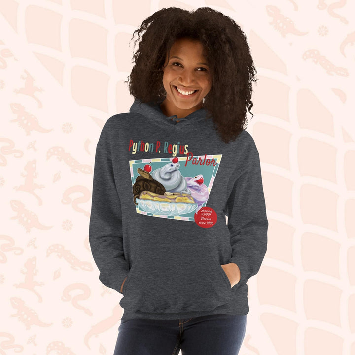 A dark grey hoodie with a retro-style graphic of a sundae with three ball pythons on top. The graphic says "Python P. Regius Parlor" and "Serving 2,000+ flavors since 1990".