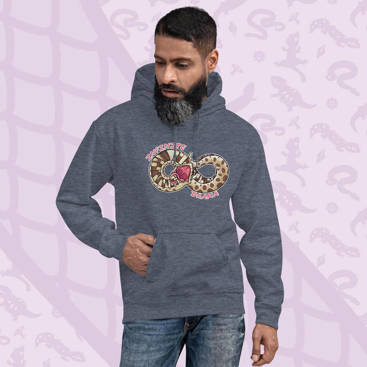 A man wearing a grey pullover hood with a silly cartoon graphic of a hognose in a figure "8" shape. It's tail is draped over it's head in a dramatic fashion and the text Infinite Drama is placed on opposite sides of the snakes body. The hoodie is made of cotton and has a front pouch sewn in.