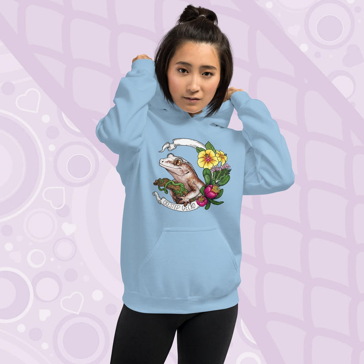 Light blue hoodie with a graphic of a crested gecko with flowers and the text "Crested Gecko".