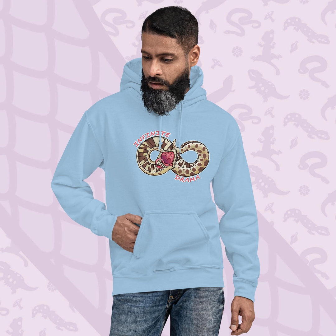 A man wearing a soft light blue pullover hood with a silly cartoon graphic of a hognose in a figure "8" shape. It's tail is draped over it's head in a dramatic fashion and the text Infinite Drama is placed on opposite sides of the snakes body. The hoodie is made of cotton and has a front pouch sewn in.
