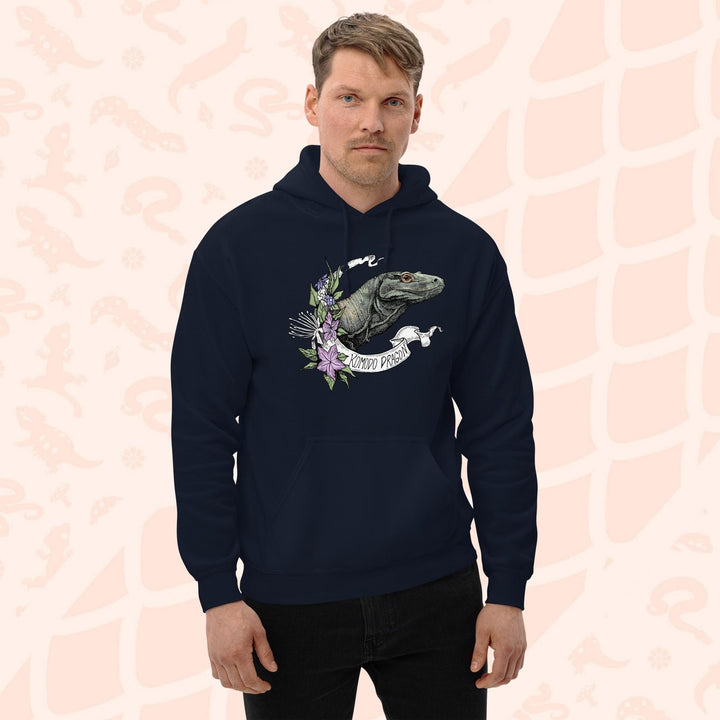 A navy blue hooded sweatshirt with a graphic print of a Komodo dragon with purple flowers and the text "Komodo Dragon" on the white banner framing the design. The hoodie has a front pocket.