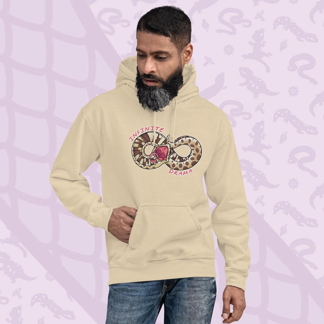 A man wearing a soft cream pullover hood with a silly cartoon graphic of a hognose in a figure "8" shape. It's tail is draped over it's head in a dramatic fashion and the text Infinite Drama is placed on opposite sides of the snakes body. The hoodie is made of cotton and has a front pouch sewn in.