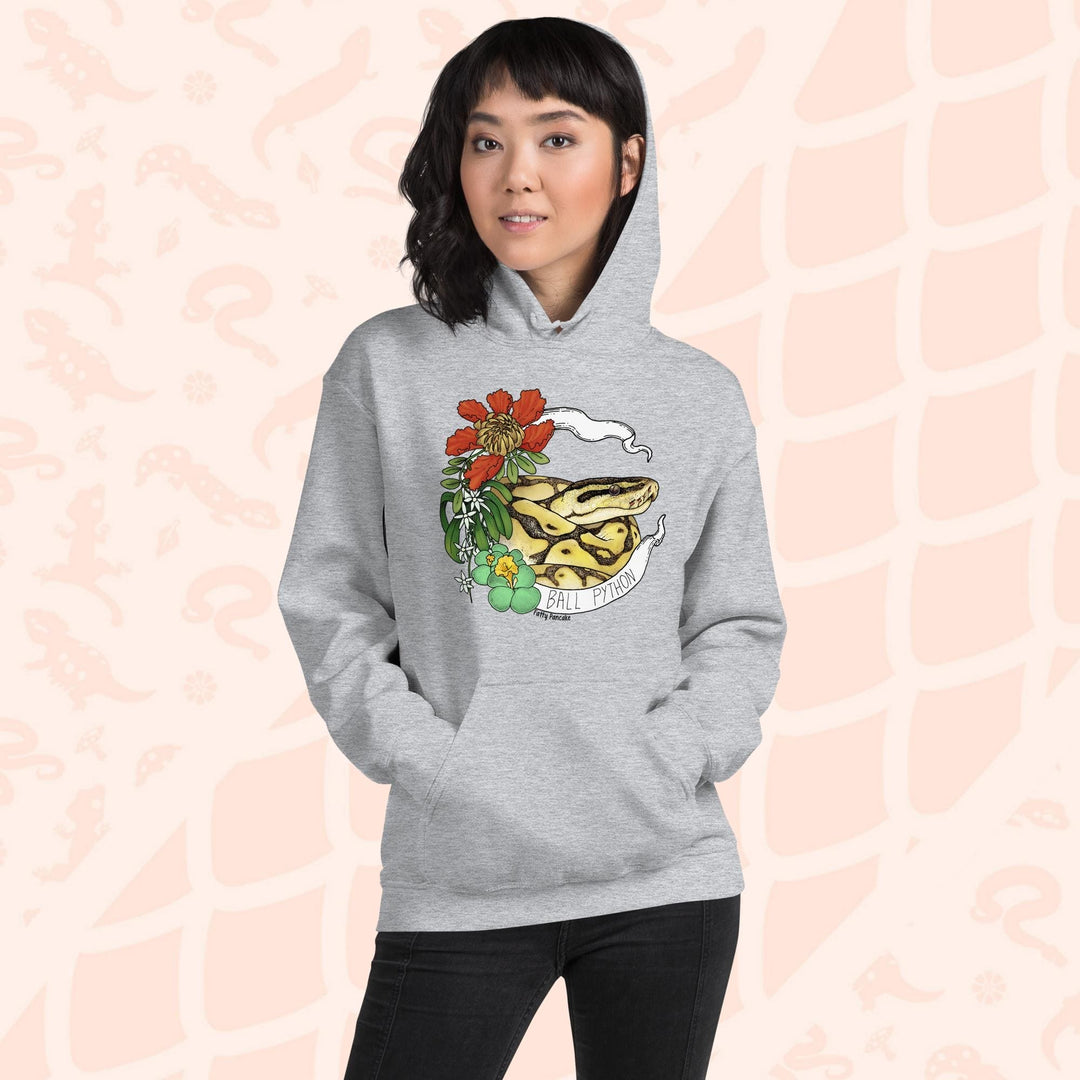 A light grey hoodie with a graphic of a ball python snake with flowers and the text "Ball Python" on a white banner.
