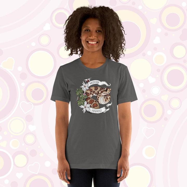 Image shows a woman wearing a grey crew neck tee with a western hognose graphic framed with cactus and white flowers and a banner that has the text, "Western Hognose" on it.