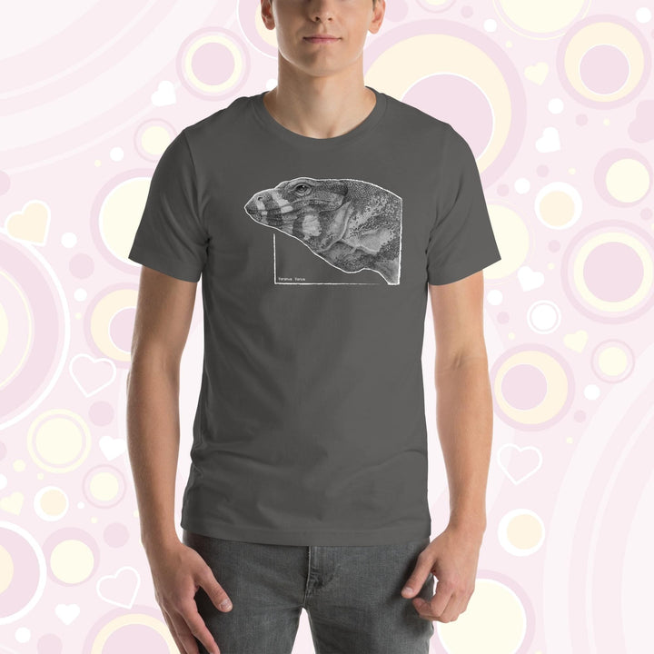 Man wearing asphalt grey crew neck tee with a graphite drawn lace monitor lizard, it is very detailed showing many tiny scales in the art design.