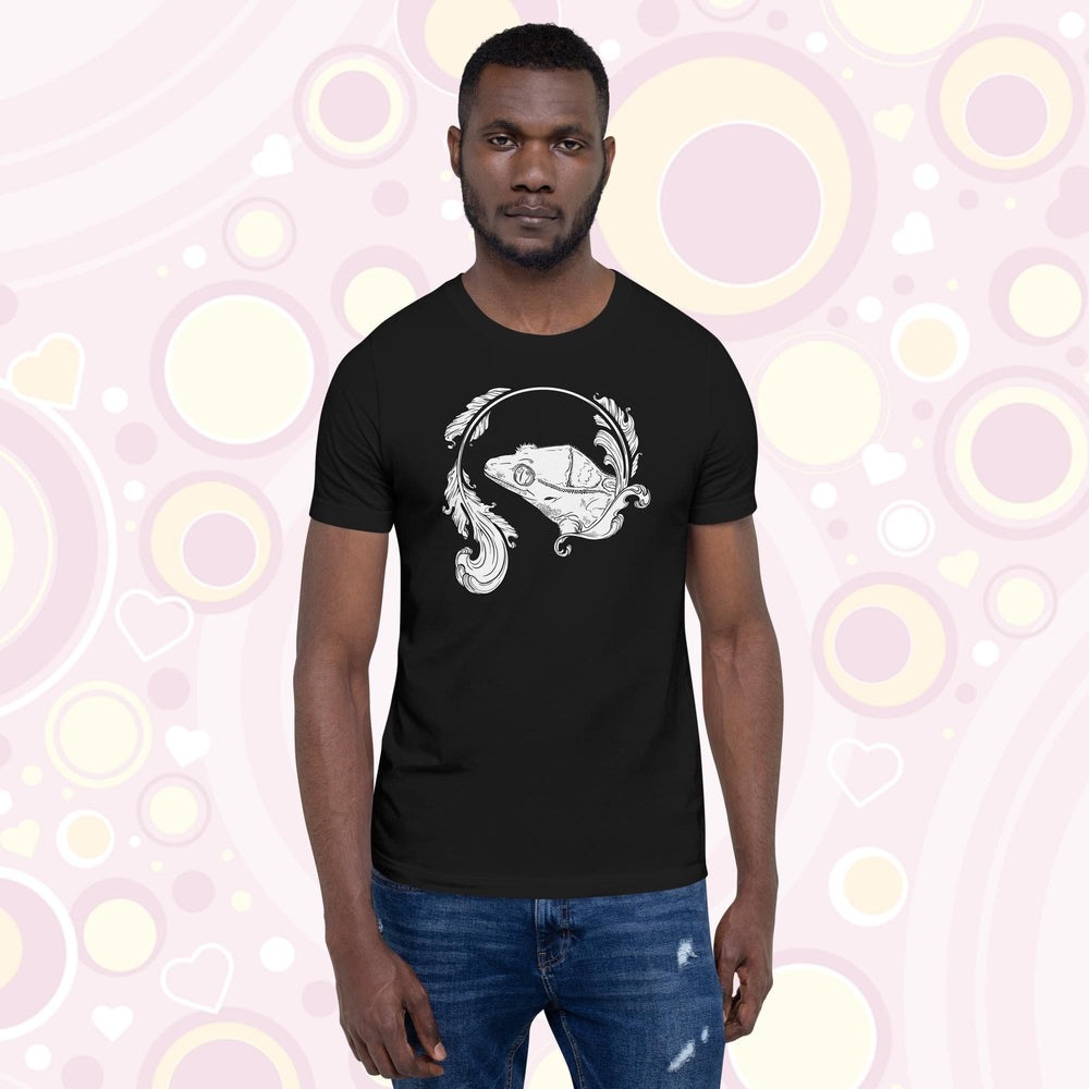 Man wearing black crew neck tee with a black and white graphic of a crested gecko done in delicate line work and elegant flourish designs.