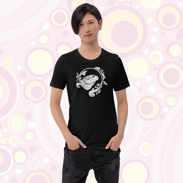 Person wearing a black crew neck tee showing an elegant design of a bearded dragon with a swooshing flourish design.