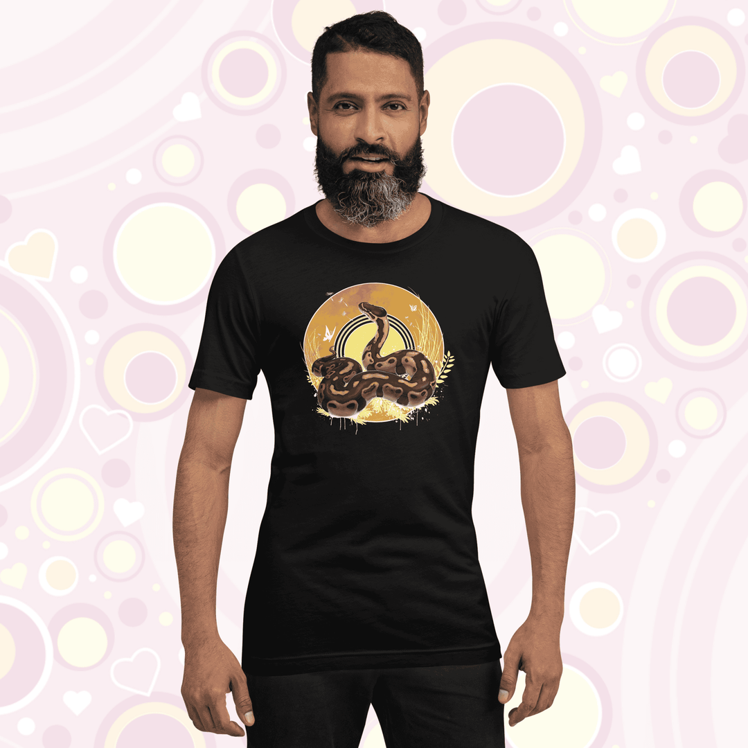 Man wearing black colored crew neck tee with a ball python resting atop of a circle with warm amber colors of fall with simple yellow leaf designs.