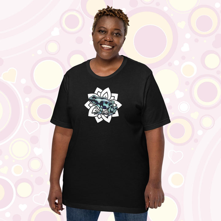 Plus sized woman wearing black crew neck tee with a black and teal poison dart from resting on a simple white floral design.