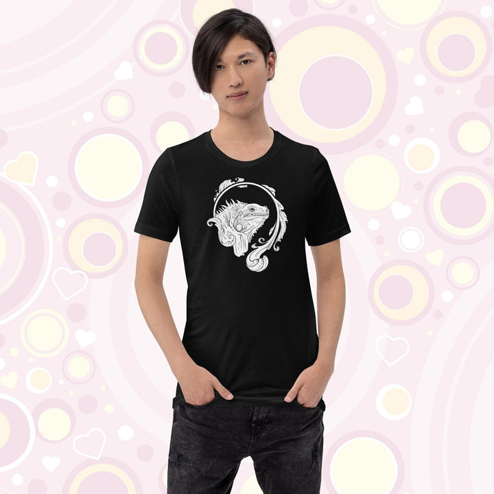 Teen wearing a black crew neck tee with a black and white line art graphic of an iguana with an elegant flourish design swirling around the animal.