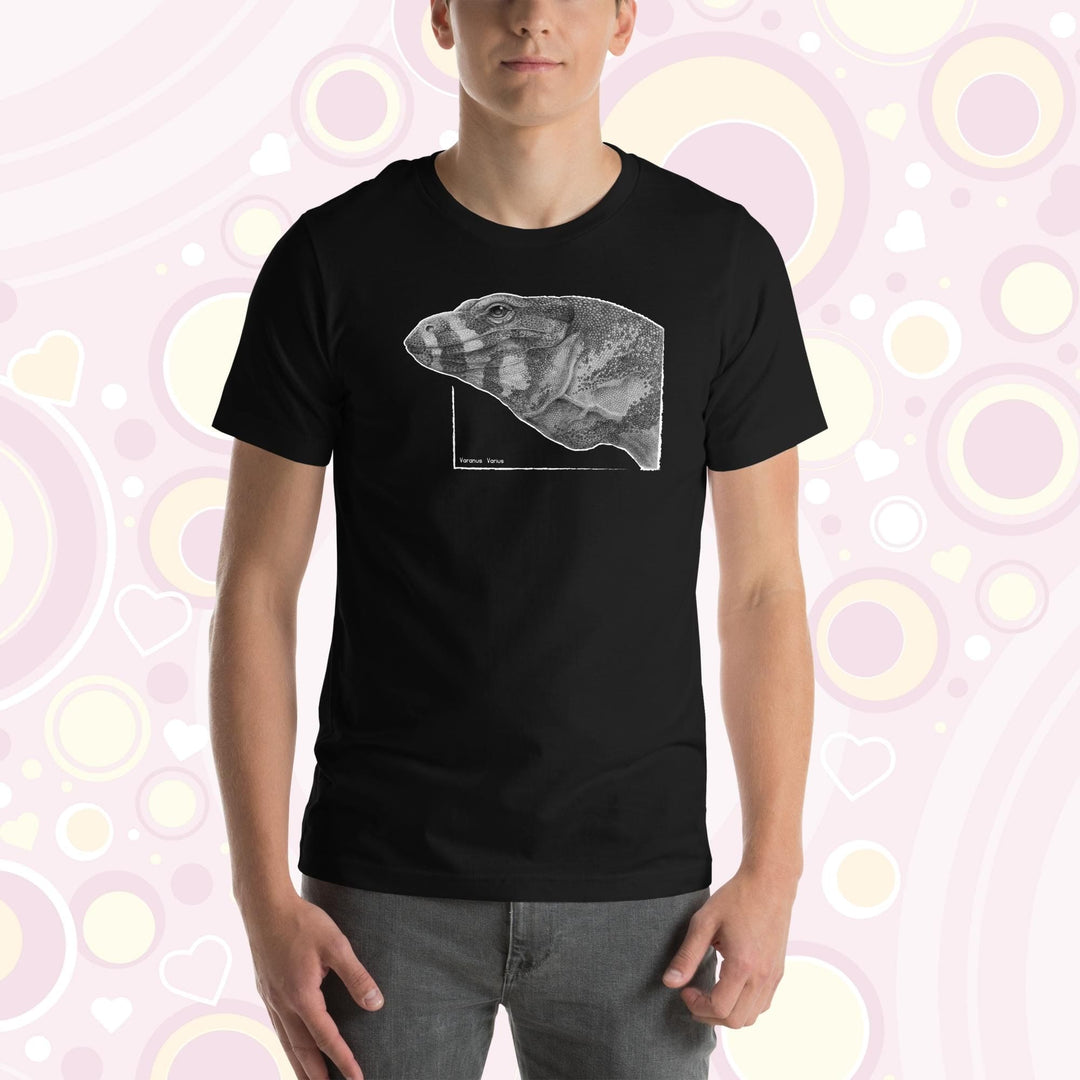 Man wearing black crew neck tee with a graphite drawn lace monitor lizard, it is very detailed showing many tiny scales in the art design.