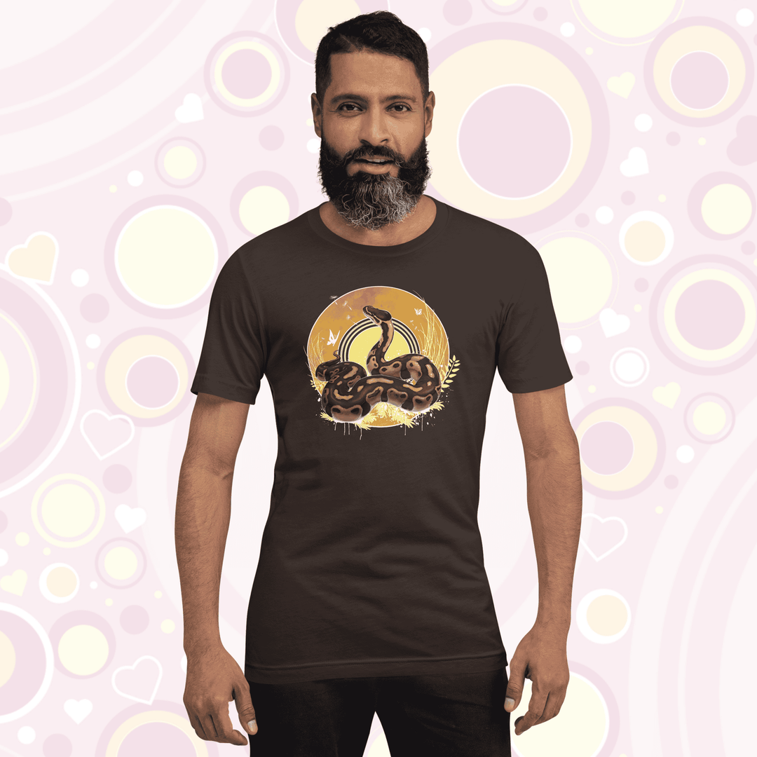 Man wearing brown colored crew neck tee with a ball python resting atop of a circle with warm amber colors of fall with simple yellow leaf designs.