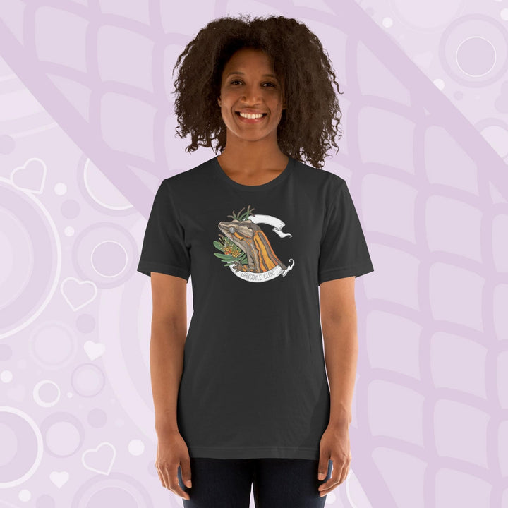 A woman wearing a dark grey colored crew neck shirt with an orange striped gargoyle gecko graphic in the middle of the shirt. 