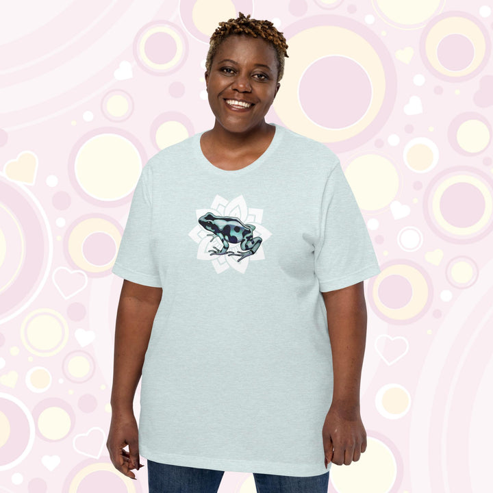 Plus sized woman wearing heather prism ice blue crew neck tee with a black and teal poison dart from resting on a simple white floral design.