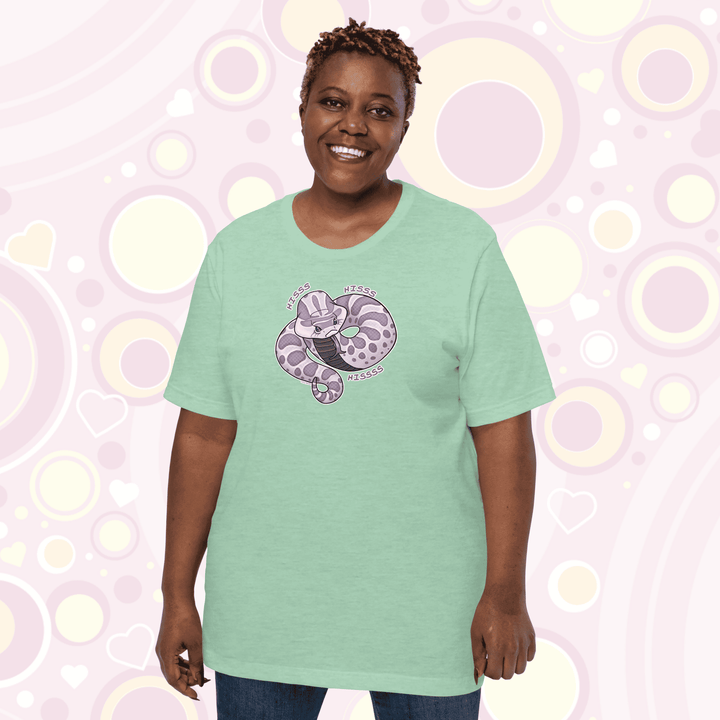 Plus sized woman wearing mint colored crew neck tee of a cartoon hognose snake saying hiss hiss hiss!