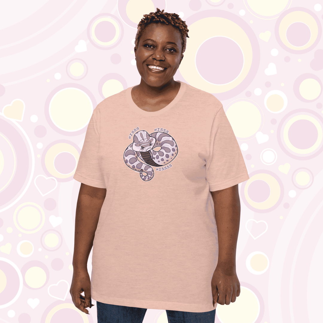 Plus sized woman wearing peach colored crew neck tee of a cartoon hognose snake saying hiss hiss hiss!