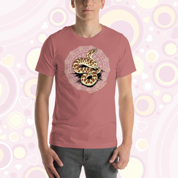 A man wearing a mauve colored crew neck tee with a Western Hognose snake in the center of a circular design with many embellishments.