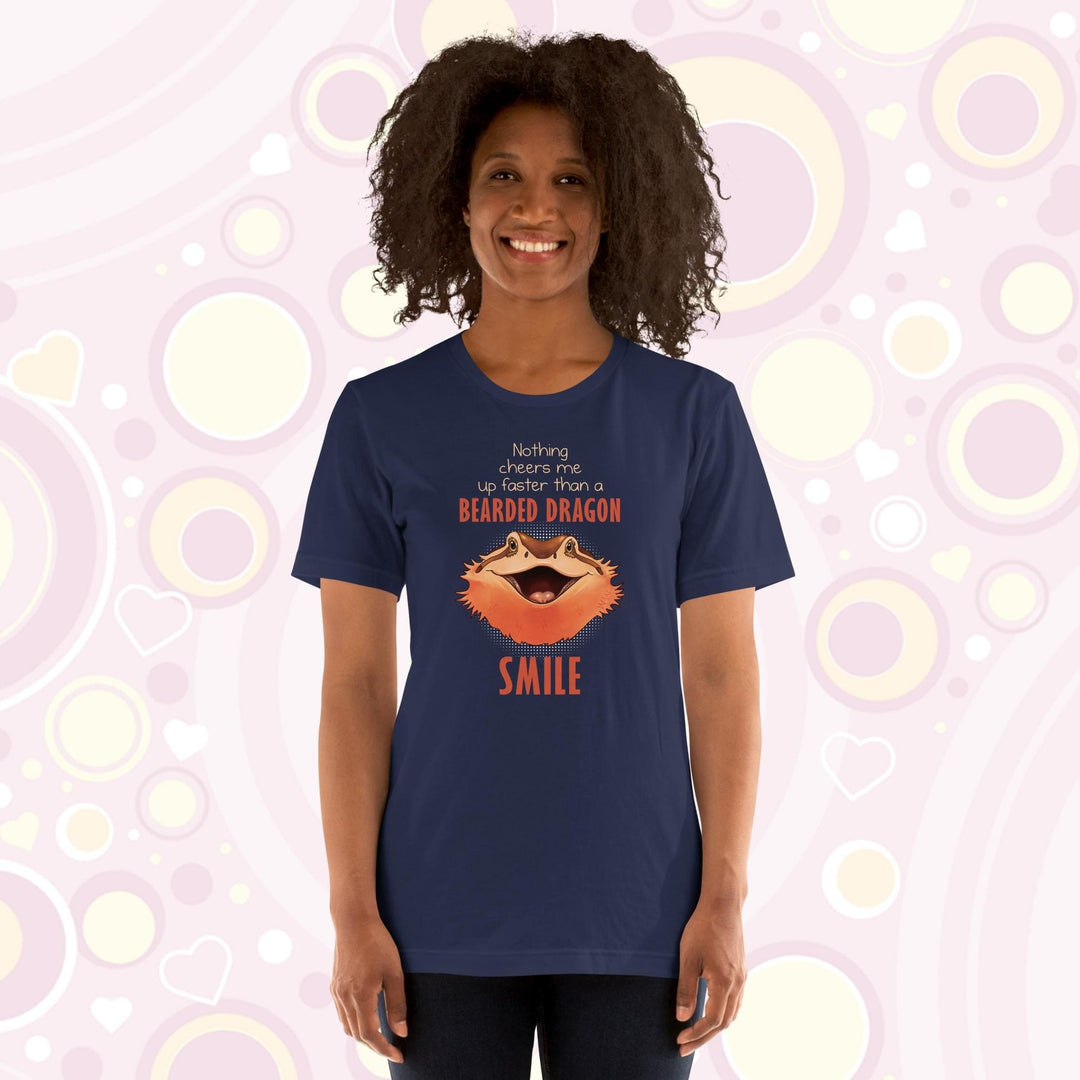 A folded navy crew neck tee showing a smiling bearded dragon with the text Nothing cheers me up faster than a bearded dragon smile.